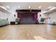 Spacious community hall with stage and seating at 650 S Clinton St St # 6, Denver, CO 80247