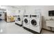 Shared laundry facility with multiple washers and dryers at 650 S Clinton St St # 6, Denver, CO 80247