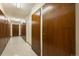 Building storage hallway with wood doors and tile floor at 650 S Clinton St St # 6, Denver, CO 80247