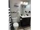 Clean bathroom with dark vanity and shower/tub combo at 1350 Josephine St # 403, Denver, CO 80206