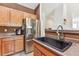 Modern kitchen with stainless steel appliances and dark countertops at 22933 E Ontario Dr # 105, Aurora, CO 80016