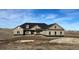 New construction home boasts a large front yard and neutral siding at 270 High Meadows Loop, Elizabeth, CO 80107