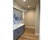 Bright laundry room with gray cabinets and quartz countertop at 270 High Meadows Loop, Elizabeth, CO 80107