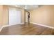 Basement bedroom with laminate flooring, white closet doors, and neutral paint at 10916 Towerbridge Rd, Highlands Ranch, CO 80130