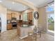 Kitchen with granite countertops, stainless steel appliances, breakfast bar, and tile floor at 10916 Towerbridge Rd, Highlands Ranch, CO 80130