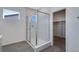 Bathroom with a walk-in shower and linen closet at 13521 E 99Th Pl, Commerce City, CO 80022