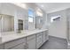 Double vanity bathroom with walk-in shower at 13521 E 99Th Pl, Commerce City, CO 80022