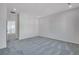 Bedroom with carpet flooring and access to upper hall at 13521 E 99Th Pl, Commerce City, CO 80022
