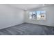Spacious bedroom with carpet and large windows at 13521 E 99Th Pl, Commerce City, CO 80022