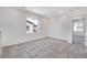 Spacious loft area with carpeted floors and a window at 13521 E 99Th Pl, Commerce City, CO 80022