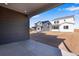 Covered patio overlooking a backyard and neighboring houses at 13521 E 99Th Pl, Commerce City, CO 80022
