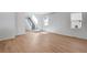 Spacious living room with light wood floors at 13521 E 99Th Pl, Commerce City, CO 80022
