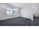 Bright bedroom with carpet and access to bathroom at 13521 E 99Th Pl, Commerce City, CO 80022