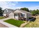 Ranch style home with landscaped yard and attached two-car garage at 1021 Berganot Trl, Castle Pines, CO 80108