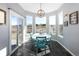 Breakfast nook with views of backyard and a round table at 1027 Southbury Pl, Highlands Ranch, CO 80129