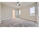 Well-lit bedroom with carpeted floors and a view at 1670 Simms St, Lakewood, CO 80215