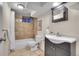 Basement bathroom with shower/tub combo, toilet and vanity at 8945 Cole Dr, Arvada, CO 80004