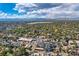 Aerial perspective of houses, a lake, and mountain views in the background at 2736 W 24Th Ave, Denver, CO 80211