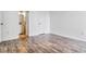 Bedroom with ensuite bathroom and wood-look laminate floors at 1648 S Cole St # B7, Lakewood, CO 80228