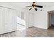 Bright bedroom with wood-look flooring and white closet doors at 1648 S Cole St # B7, Lakewood, CO 80228