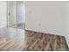 Bright bedroom with wood-look laminate floors and sliding glass door to patio at 1648 S Cole St # B7, Lakewood, CO 80228