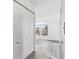 Entryway with white closet doors and wood-look laminate floors at 1648 S Cole St # B7, Lakewood, CO 80228