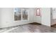 Entryway with gray wood-look flooring, a window, and a door with decorative glass at 1648 S Cole St # B7, Lakewood, CO 80228