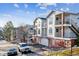Exterior of a multi-story condo building with balconies and garages at 1648 S Cole St # B7, Lakewood, CO 80228