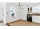 Kitchen with white cabinets, a black dishwasher, and a view from the window at 1648 S Cole St # B7, Lakewood, CO 80228