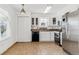 Kitchen featuring white cabinets, stainless steel appliances, and tiled floors at 1648 S Cole St # B7, Lakewood, CO 80228