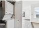 Laundry area with stacked washer and dryer at 1648 S Cole St # B7, Lakewood, CO 80228