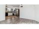 Open concept dining area and kitchen with white cabinets and stainless steel appliances at 1648 S Cole St # B7, Lakewood, CO 80228