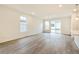 Bright and airy living room features large windows and sliding glass doors leading to the backyard at 9310 Bahama Ct, Commerce City, CO 80022