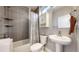 Clean bathroom with tub, shower, and neutral tile at 2815 W 25Th Ave # 2, Denver, CO 80211