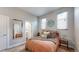 Bright bedroom with ensuite bathroom access and window at 2815 W 25Th Ave # 2, Denver, CO 80211