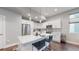 Modern kitchen with white cabinets, stainless steel appliances, and an island at 2815 W 25Th Ave # 2, Denver, CO 80211