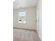 Simple bedroom with carpeted floor, window, and door at 13610 Topaz Pl, Mead, CO 80504