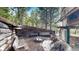Cozy outdoor fire pit area with wooden benches at 131 Russel Gulch Rd, Central City, CO 80403