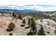 Aerial view of property with mountain views and a trail at 131 Russel Gulch Rd, Central City, CO 80403