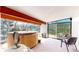 Relaxing hot tub with mountain views from a sunroom at 131 Russel Gulch Rd, Central City, CO 80403