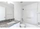 Clean bathroom, granite countertop, and a bathtub at 7446 S Norfolk Way, Aurora, CO 80016