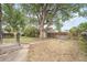 Large backyard with mature trees and detached garage at 4636 Beach Ct, Denver, CO 80211