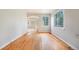 Hardwood floor dining room with view into living room at 4636 Beach Ct, Denver, CO 80211