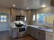 Newly remodeled kitchen with stainless steel appliances and gray cabinets at 4636 Beach Ct, Denver, CO 80211