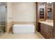 Bathroom with a free-standing bathtub and double vanity at 100 Detroit St # 406, Denver, CO 80206