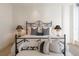 Elegant bedroom with a metal bed frame and city views at 100 Detroit St # 406, Denver, CO 80206