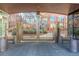 Gated entrance to a residential community with ornate iron gates at 100 Detroit St # 406, Denver, CO 80206