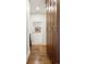 Bright hallway with hardwood floors and built-in storage at 100 Detroit St # 406, Denver, CO 80206