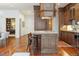 Gourmet kitchen boasts a large island, custom cabinetry, and high-end appliances at 100 Detroit St # 406, Denver, CO 80206