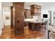 Gourmet kitchen with custom cabinetry, granite counters, and island at 100 Detroit St # 406, Denver, CO 80206